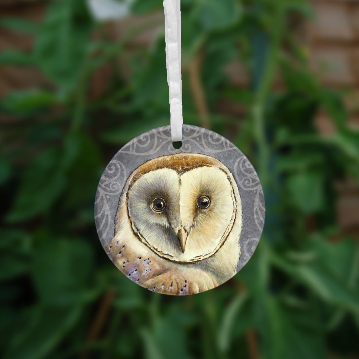The second side of the ornament, showing a close-up of the owl's face.