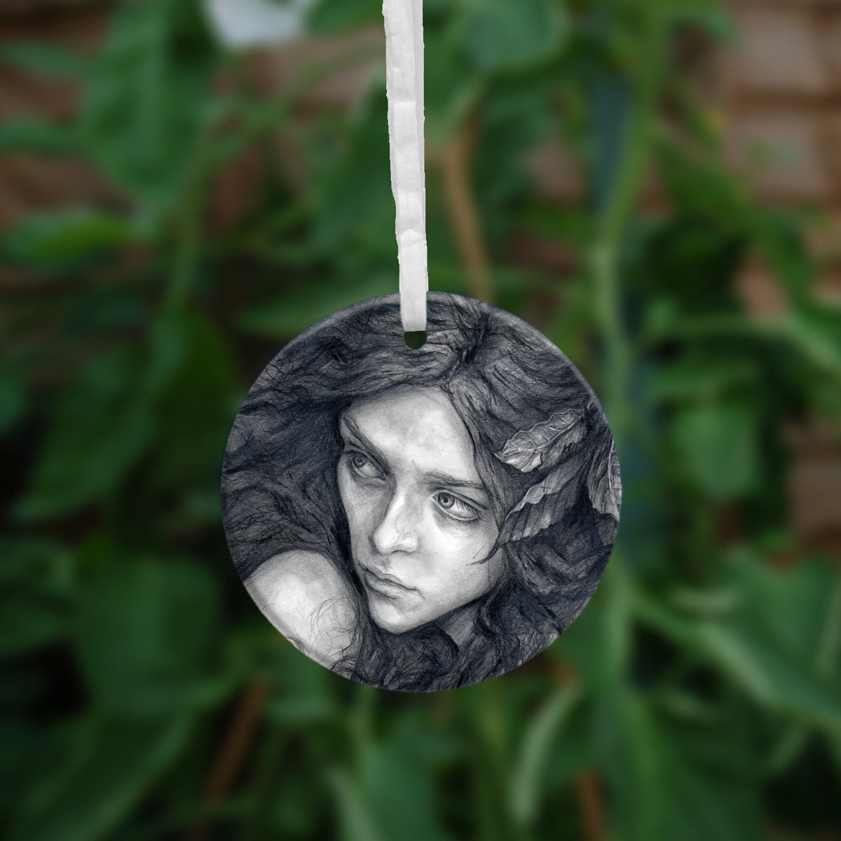 The other side of the ornament, showing a close-up of the woman's face.