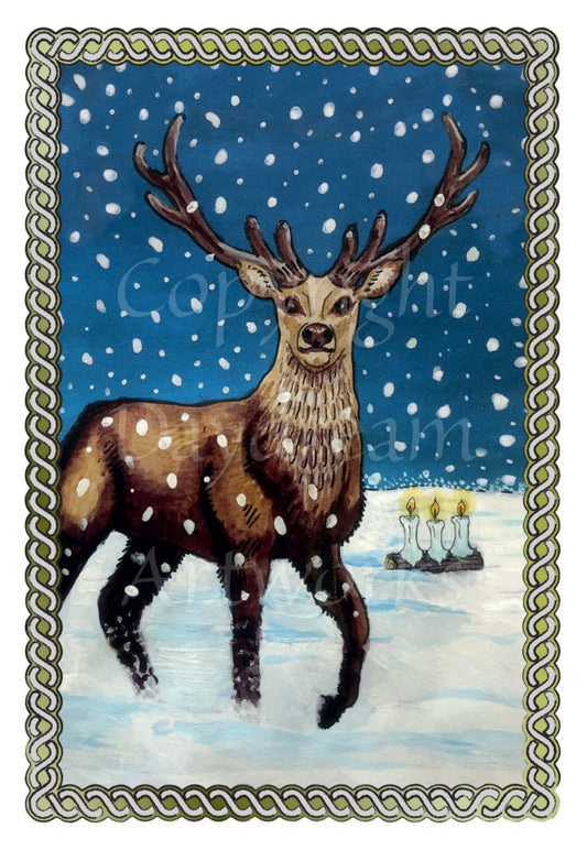 Snow falls around a stag standing in snow, facing the viewer. Three lit candles burn on a log behind him. The snow extends into the distance, ending in a dark blue sky.  A twisted rope border surrounds the design.