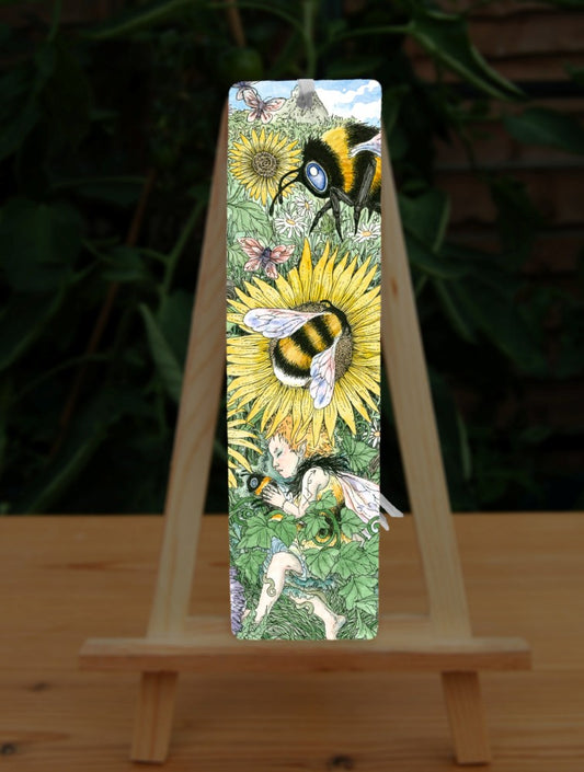 A meadow of green foliage and yellow, blue, pink and purple flowers rises towards a blue sky in the distance. A bee descends towards a central yellow flower. Another bee is already sitting in the middle of it. At the bottom, a fairy with orange hair and bee-coloured dress sleeps while holding a bee.