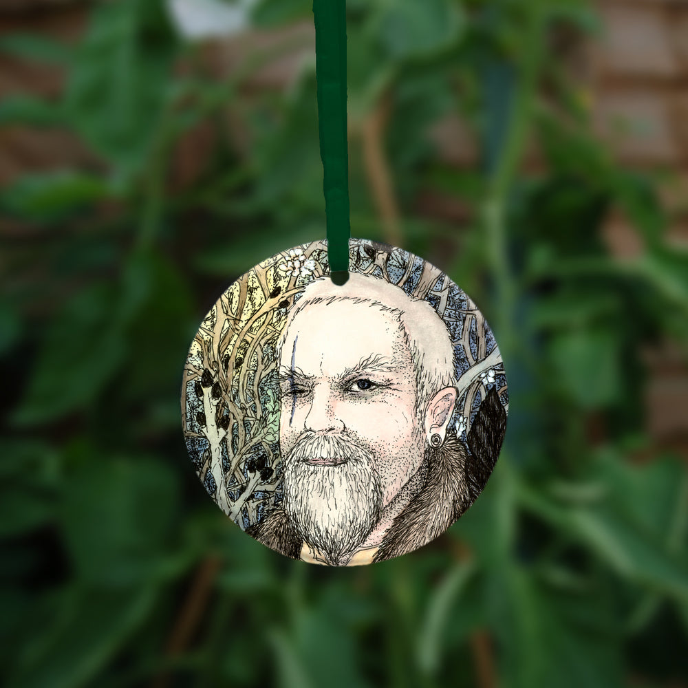 The other side of the ornament. A man with just one eye, with a long scar going vertically through where the eye should be.