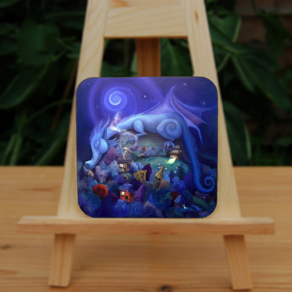 Painting of a blue dragon with rounded body shape and features sleeps on a hill, his head and tail draped down either side. Sheep graze on the hill. At the bottom of the hill lies a village with colourful trees, houses and castle. A crescent moon shines overhead.