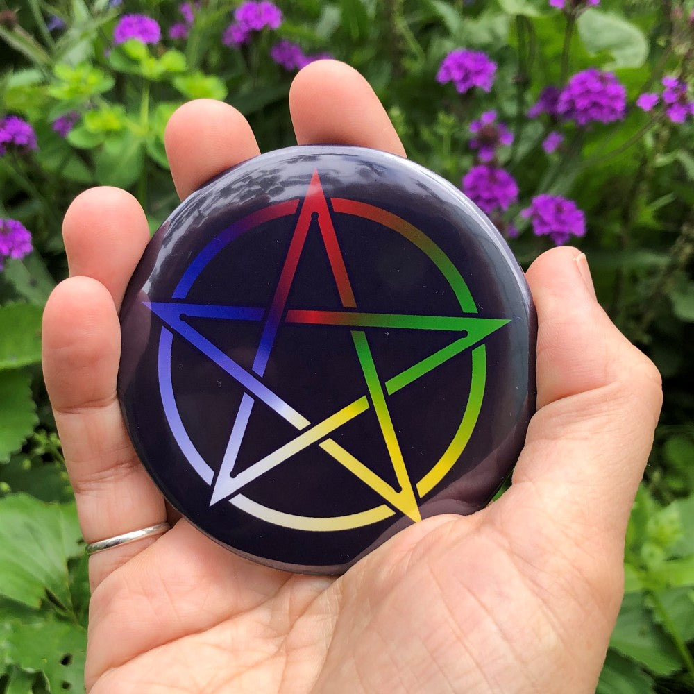 Illustration of a pentagram which is multi-coloured, starting white at the top, then clockwise through blue, red, green and yellow. The background is dark blue.