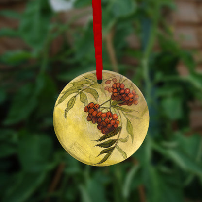The other side of the ornament, showing a cluster of rowan berries and leaves.