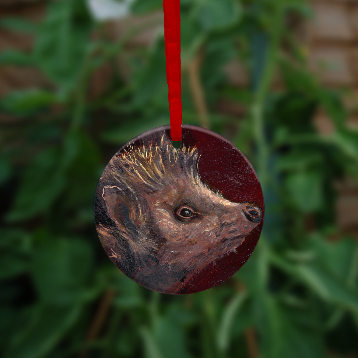 The reverse side of the ornament showing a close-up of the hedgehog's head.