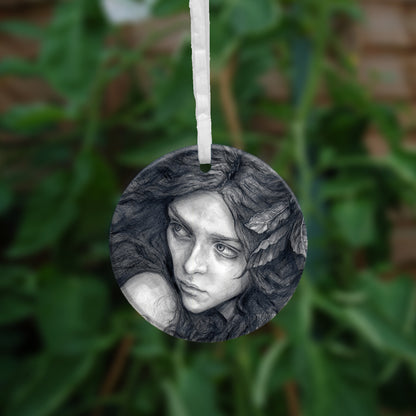 The other side of the ornament, showing a close-up of the woman's face.