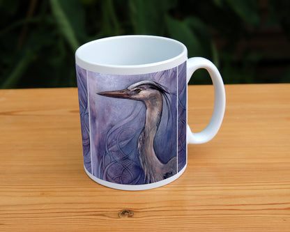 A white ceramic mug: A sideways view of the head and neck of a heron. The background is a mottled purple with a swirl pattern.