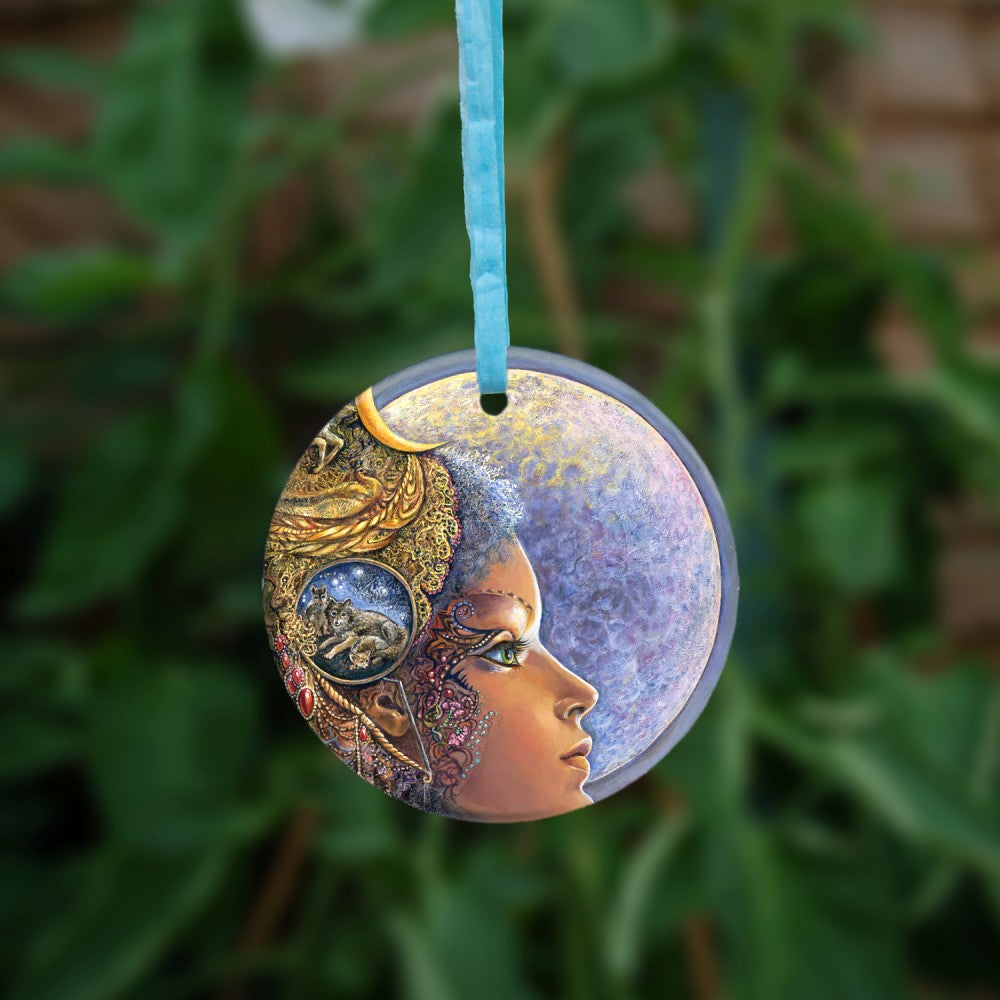 The reverse side of the ornament. A colourful image of a young woman facing to the right with a full moon shining behind her.