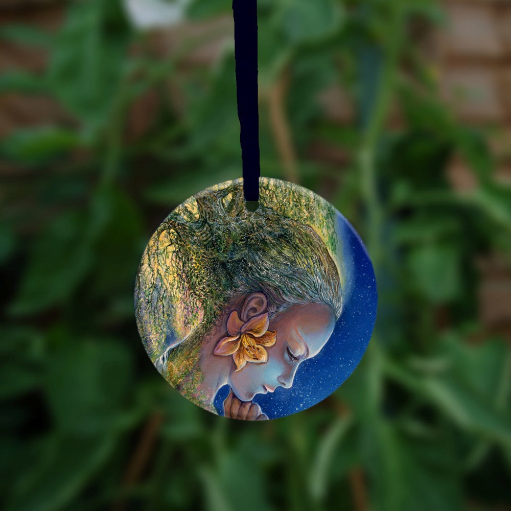 The reverse side of the ornament. A young woman, head lowered and holding her arms under her chin.