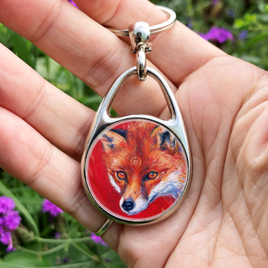 The head of a red fox looking at an angle towards the viewer, coming into the painting from the right. A pale-coloured spiral is coiled on their forehead. The background is red.