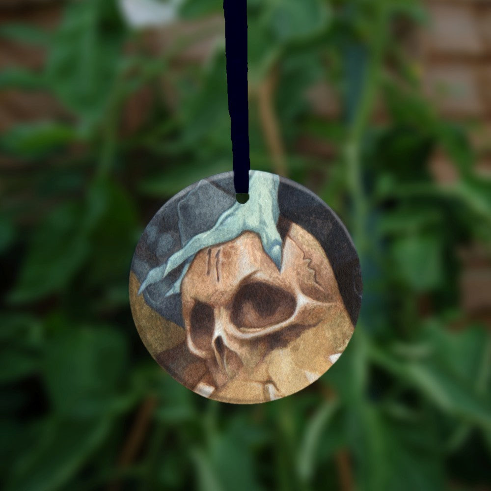 The reverse side of the ornament, showing just a hand on a skull.