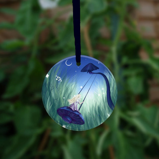 A blond-haired fairy in a pink dress sits on a swing, swinging high and nearest the viewer. The swing is made from the cap of a deep blue mushroom. The swing is suspended from another blue mushroom, its curved stem pointing towards the starlit night sky. The swing is set in deep grass, which fills the scene from left to right.