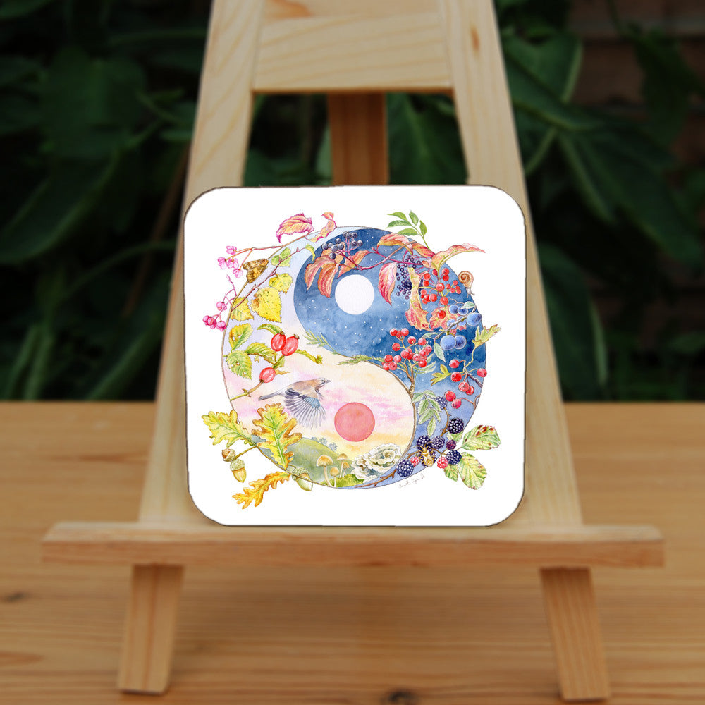 A Yin-Yang shape is surrounded by branches of native trees in autumn colours and some bearing fruit. The left hand half of the shape is filled with a pink/pale orange sky, and a large red sun forms the traditional 'dot' over a grassy hill. Autumn leaves and berries overlay the sky, a jay sings flies over, and fungi sit at the bottom. A moth sits on the outside curve. The right hand half features a dark blue sky with stars, with a white moon forming the 'dot'. Autumn leaves and berries overlay the scene.