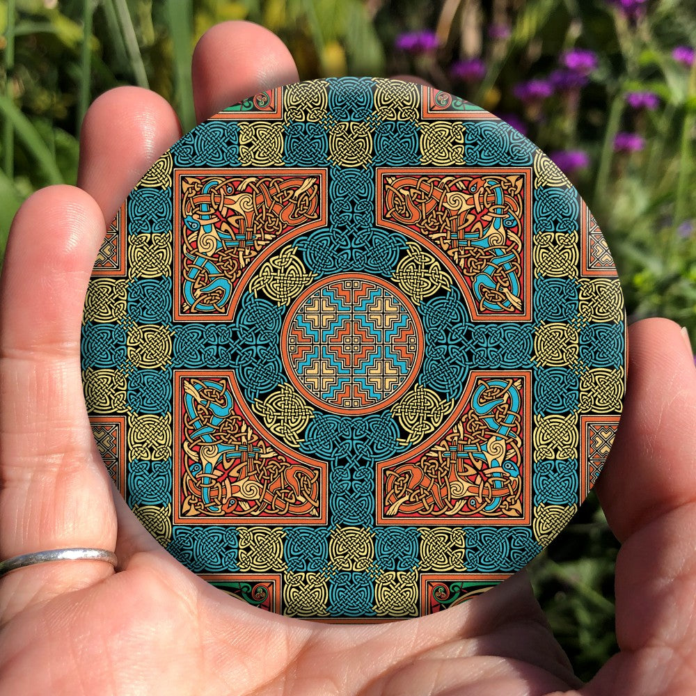 An intricate design incorporating dozens of Celtic knots. Colours are orange, beige and blue.